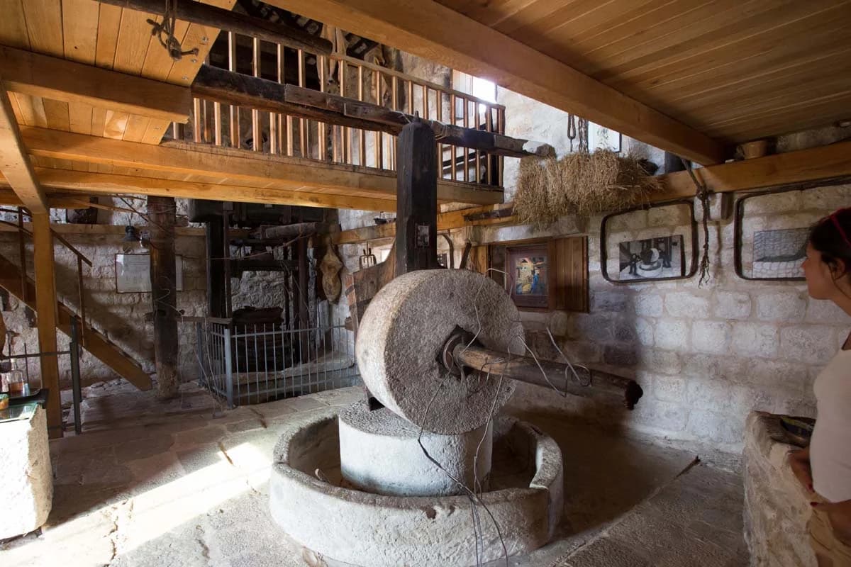 A traditional stone olive mill inside the museum.