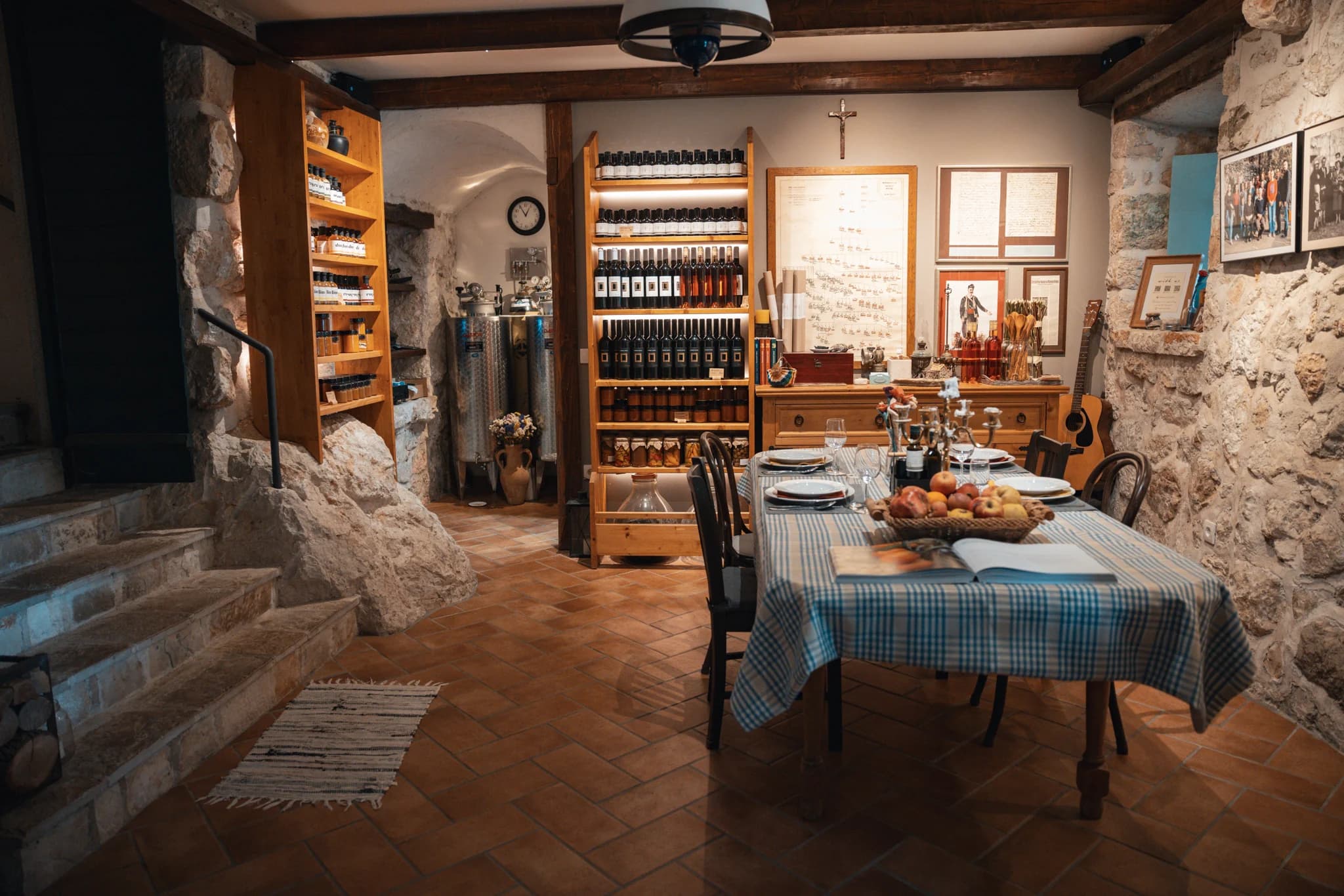 The prepared table and shelves of bottles in the family dining room.