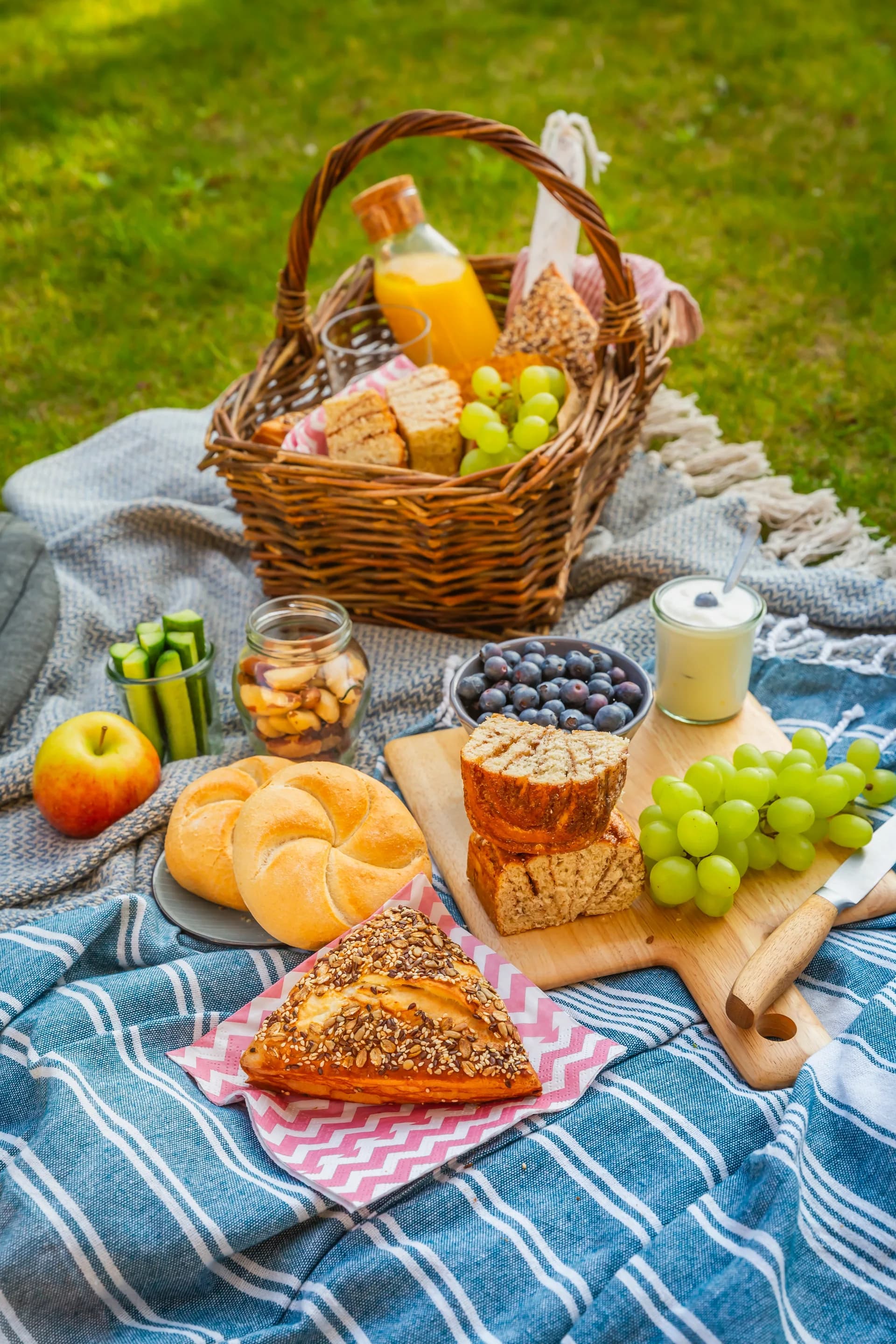 A picnic laid out for a pause in the grass.